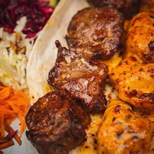 a plate of meat and vegetables