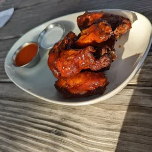 Bbq smoked wings with side of buffalo sauce