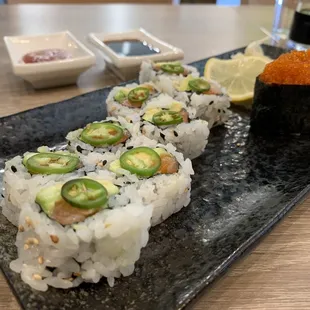 Salmon avocado roll +jalapeño and tabiko sushi