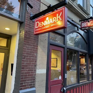 a brick building with a sign that says denmark