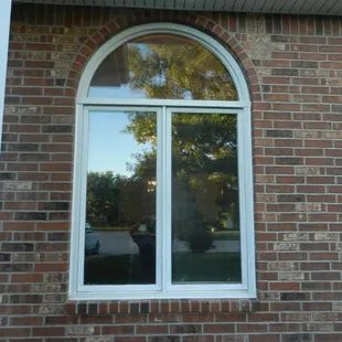 the reflection of a person in a window