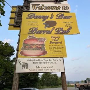 a car parked in front of the sign
