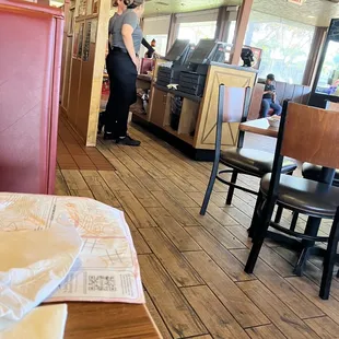 Again, standing and talking not helping anyone, even while new customers sitting and waiting, and lots of tables empty.