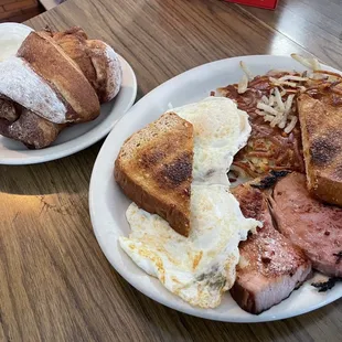 two plates of breakfast food