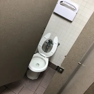 a toilet in a public restroom