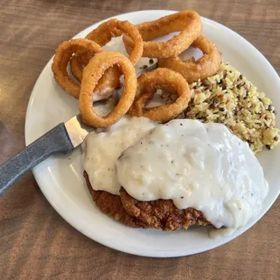 Chicken fried chicken with rice and onion rings. $15.59. Onion rings 0.99