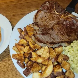 T-Bone Steak with Herb Glazed Corn and potatoes with garlic toast
