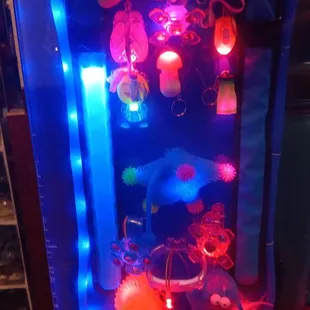 an arcade machine with lights and decorations