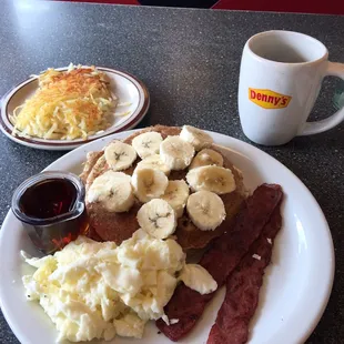 Banana Pecan Pancakes - wheat pancakes with pecan cooked inside, egg whites, turkey bacon with a side of hash browns