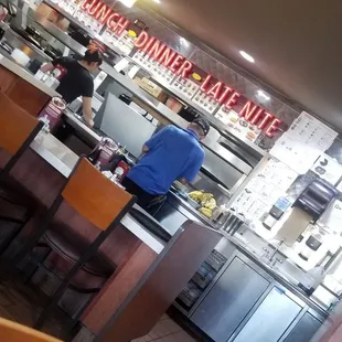 the kitchen and dining area of a restaurant