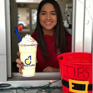 a woman holding a cup of coffee