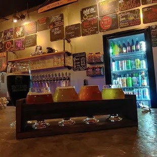 a bar with beer and beer glasses