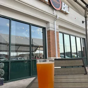 a glass of beer on a table