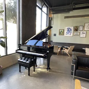 a grand piano in a coffee shop
