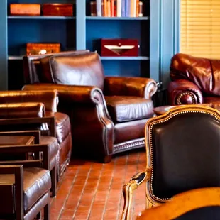 leather chairs and bookshelves