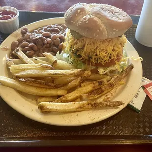 Lukewarm old fashion with unmelted cheese, skins on fries and blend pinto beans. Looks a lot better than it eats.