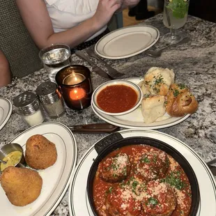 Meatballs, arancini, garlic knots