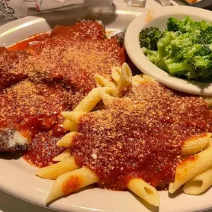 a plate of pasta, broccoli and sauce
