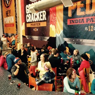 a crowd of people sitting at tables