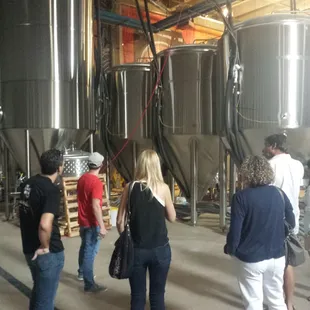 a group of people in a brewery