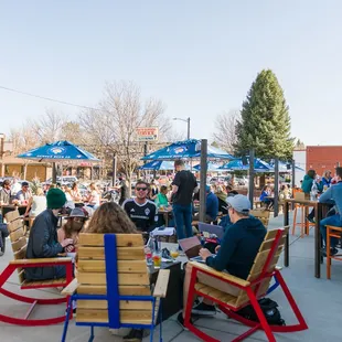 people sitting at outdoor tables