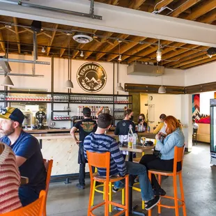 a group of people sitting at a bar