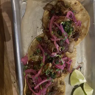 These are the &quot;tacos.&quot; They have what once may have been carnitas but then they were covered in honey for some reason?