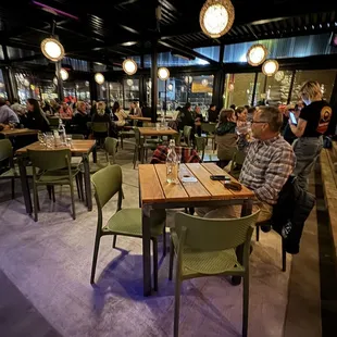 a man sitting at a table in a restaurant