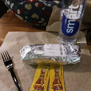 Breakfast burrito, Cholula hot sauce, and Smart Water