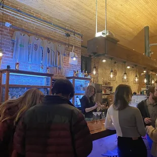 a group of people at the bar