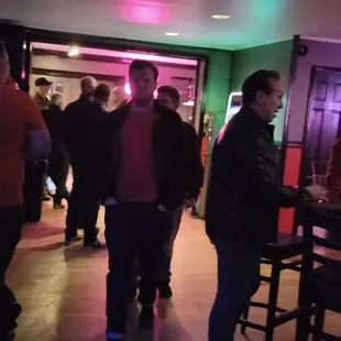 a group of people in a bar