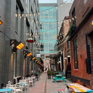 a street lined with tables and chairs