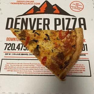 This is a brand new test pizza called the Sloans Lake yacht club. It has a mixture of red and white sauce with peppers and sausage .