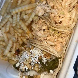 a chicken taco and french fries