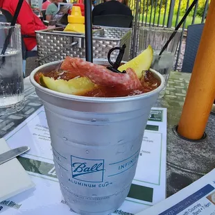 a drink in a paper cup