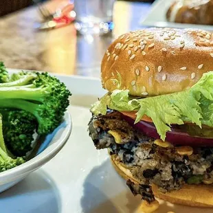 Black bean veggie burger with a side of steamed broccoli.