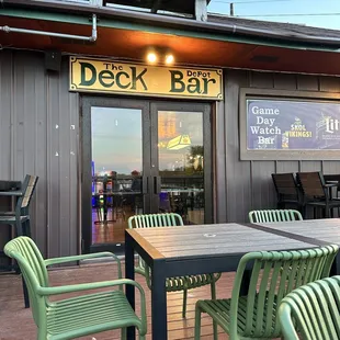 deck bar with tables and chairs