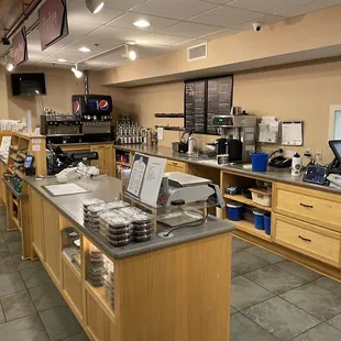 a coffee shop counter with a laptop on it