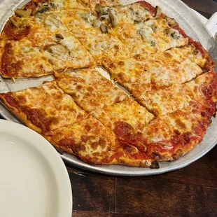 pepperoni pizza. Half with mushroom.