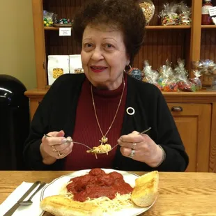 a woman eating a pizza