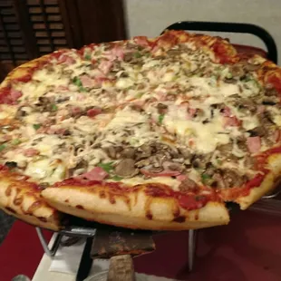 Huge!!  Knife and fork needed here!  Tastes fresh, good sauce buttery crust...whats not to love!!   Very good service !!   I will be back...