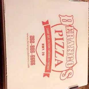 a pizza box on the floor