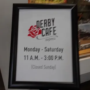 a sign for derby cafe