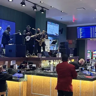 A band playing on a busy Friday night.