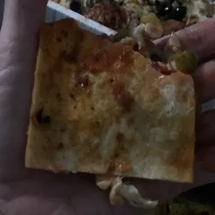 Bottom side of the crust/dough.