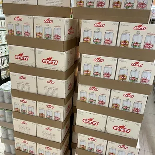 a large stack of coca bottles