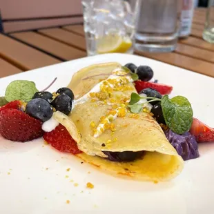 Purple Haze Crepe  ------------------ ube cream filling, berries, sour cream, pistachio pralines