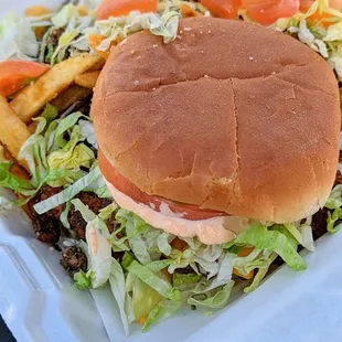 Fried Chicken Sandwich with Sriracha Mayo, Mambo Sauce, all toppings, and Taco Fries | Instagram: @telephonesmoothie