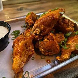 The wings with the chili oil. Be warned that while spicy, it's not flavorful. Get a dipping sauce.