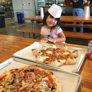 Yes, their pizzas are pricey!  But they're fresh and good quality for the price.   Soft drinks are way over price.